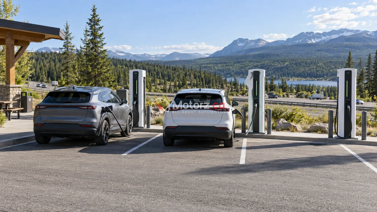 Two unbranded electric crossovers charging at a Canadian highway rest stop
